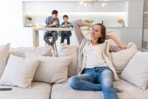 Young Woman Relaxing On Comfortable Sofa